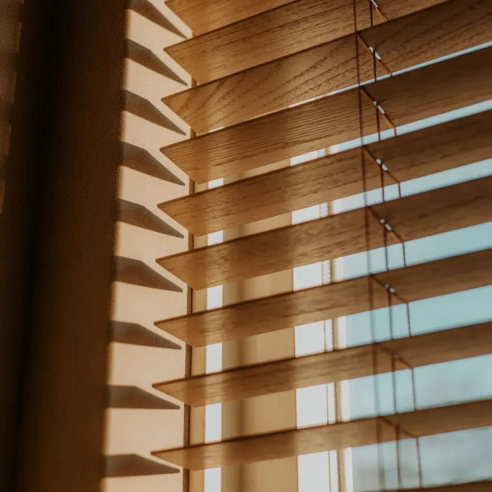 Wooden venetian slats filtering warm afternoon light