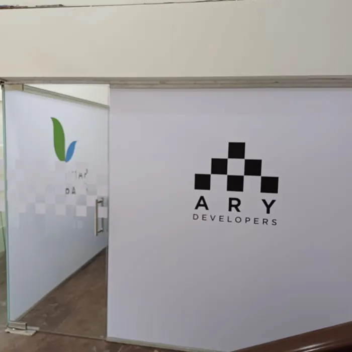 Printed vinyl brand mark applied to an office wall