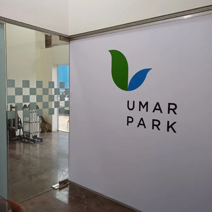 Project logo applied to a painted reception wall