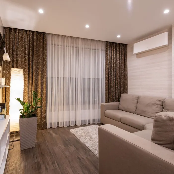 Sheer and blockout curtain layers in a lounge