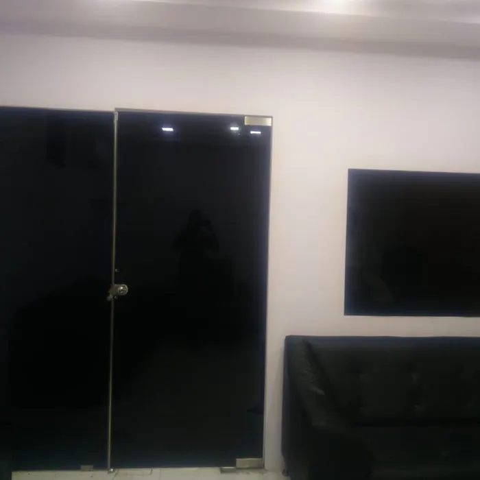 Dark tinted glass doors in a finished lounge