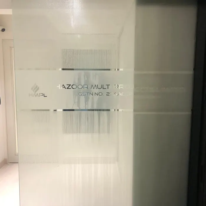 Registered company details etched into a glass entrance