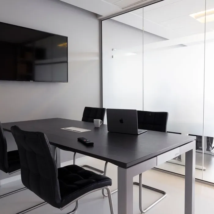 Meeting room enclosed in full-height glazing