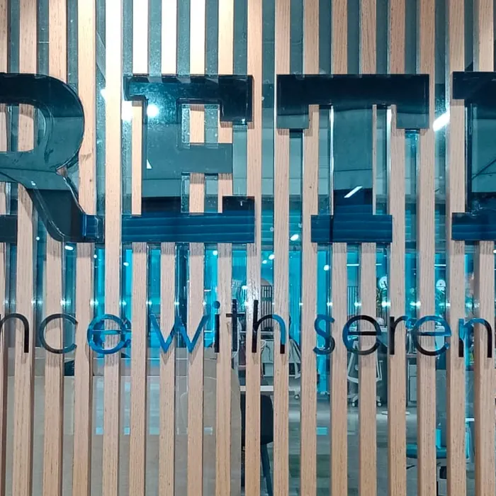 Fluted louver panelling behind reception lettering