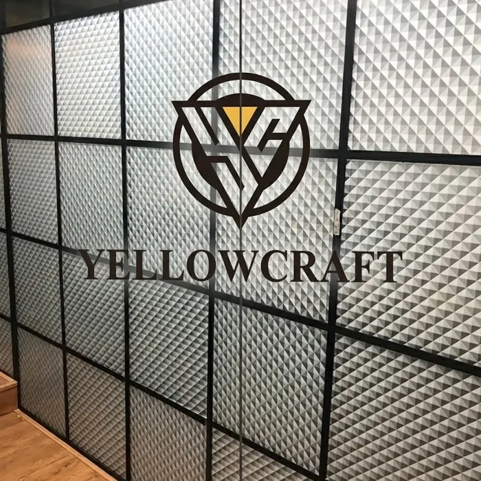 Company mark applied to a textured glass partition