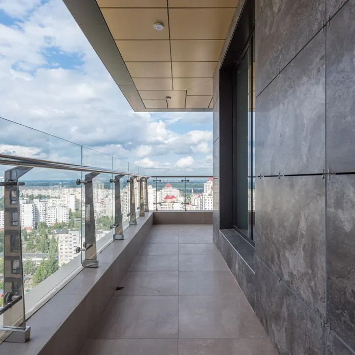 Glass balustrade around a terrace above the city