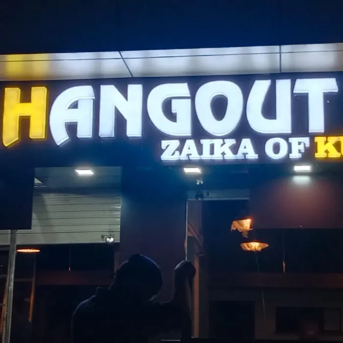 Illuminated 3D letters above a snack bar frontage