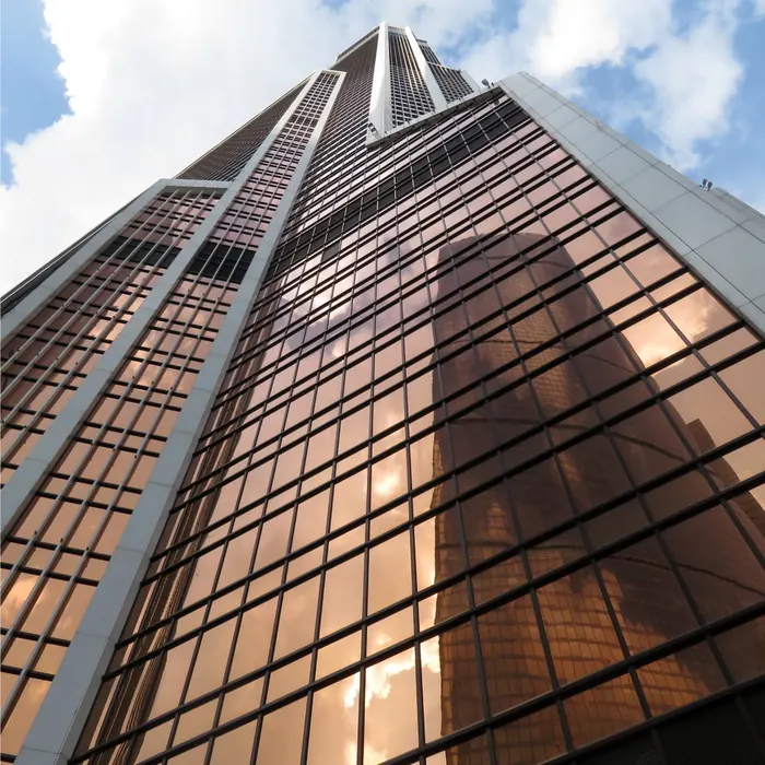 Reflective glass facade of a high-rise tower