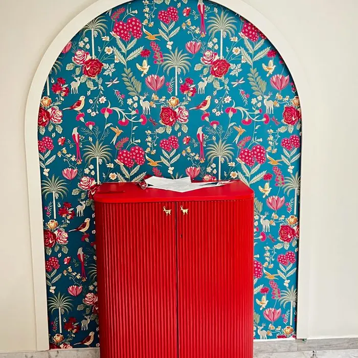 Patterned wallpaper set into an arched alcove