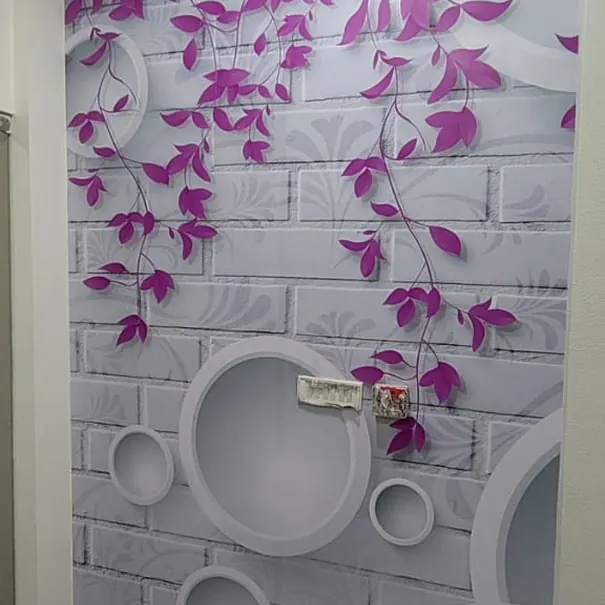 Trailing purple foliage printed on a brick-effect wall