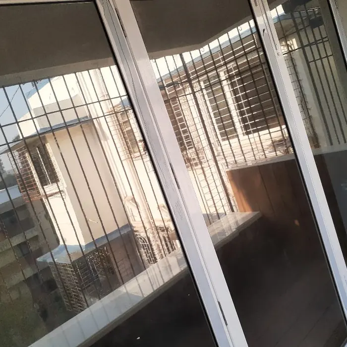 Openable window with grille and mesh fitted