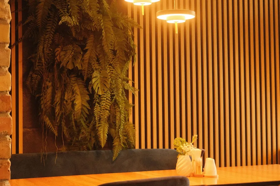 Timber slat panelling behind cafe seating